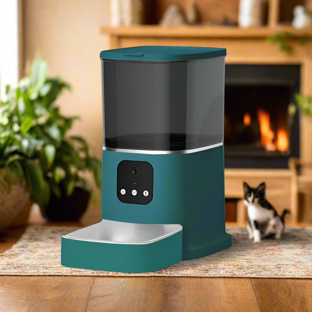 Teal pet water dispenser on a white pedestal against a light gray background