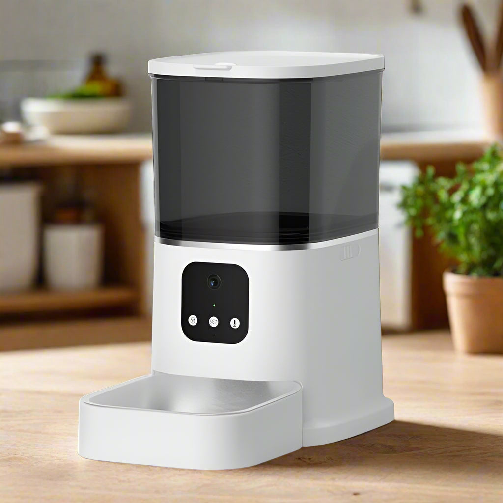 White and black pet feeder on a kitchen background